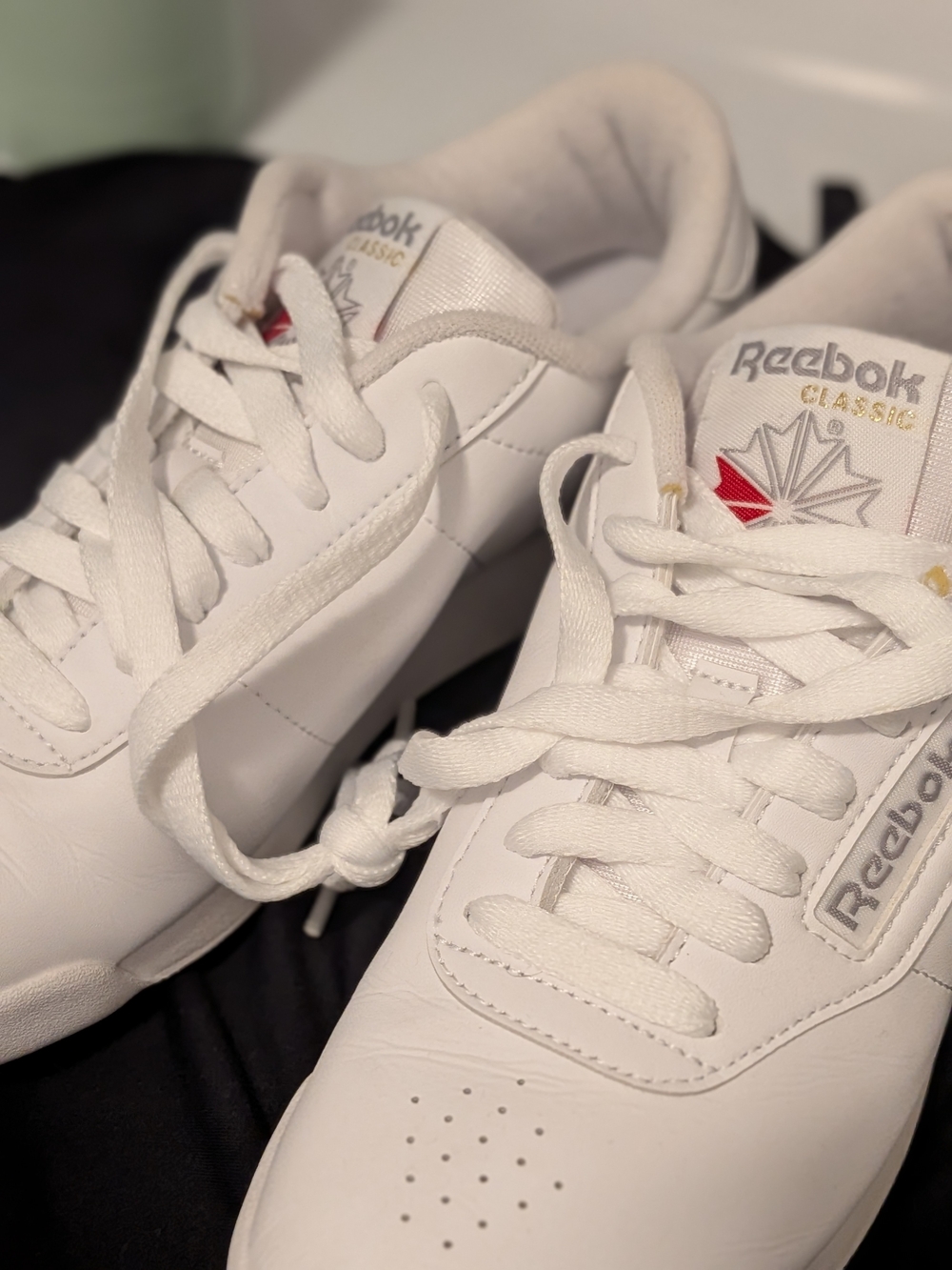 Reebok White Women's Classic Sneakers with Red Logo Accent
